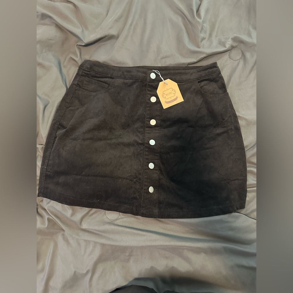 Kori size large skirt. Black velvety corduroy texture.